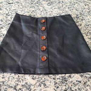 Girls black faux leather skirt